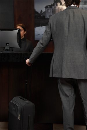 Businessman at Hotel Desk Foto de stock - Sin royalties Premium, Código: 600-00984396