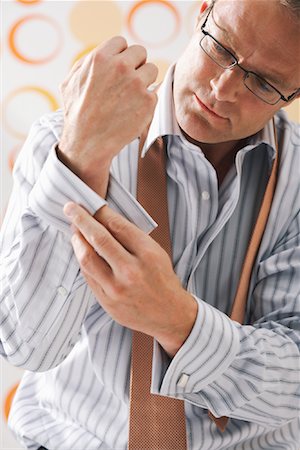 Man Getting Dressed Stock Photo - Premium Royalty-Free, Code: 600-00983049