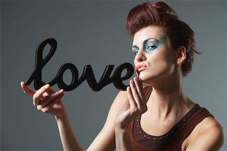 simsearch:614-08721065,k - Woman Holding Love Sign Stock Photo - Premium Royalty-Free, Code: 600-00983453