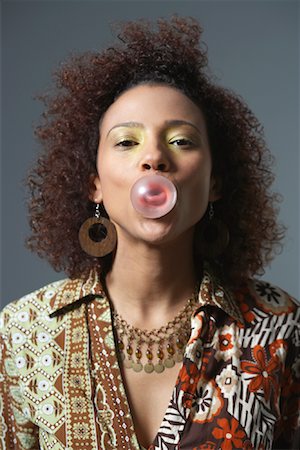 Woman Blowing Bubbles Stock Photo - Premium Royalty-Free, Code: 600-00983471