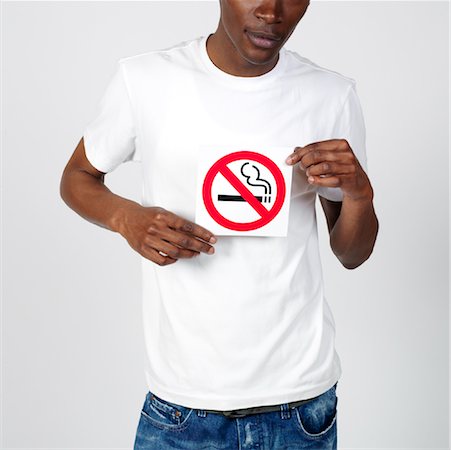 Man Holding No Smoking Sign Stock Photo - Premium Royalty-Free, Code: 600-00983697