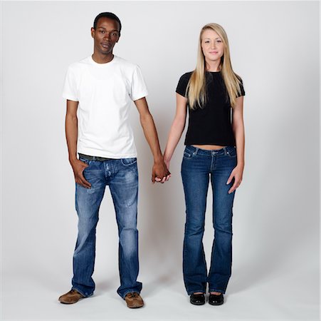 picture of white and black people holding hands - Portrait of Couple Holding Hands Stock Photo - Premium Royalty-Free, Code: 600-00983702