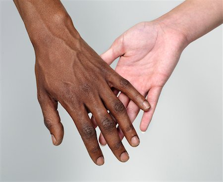 picture of white and black people holding hands - Couple Touching Hands Stock Photo - Premium Royalty-Free, Code: 600-00983717
