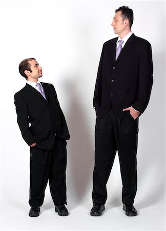 Tall man and short man Stock Photos - Page 1 : Masterfile