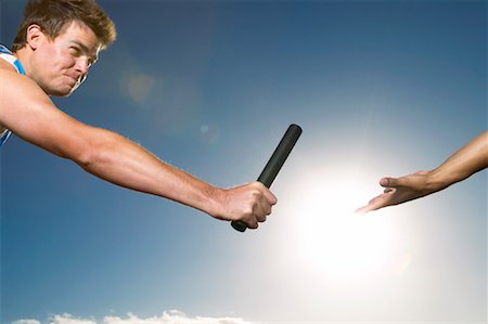 Man Passing Baton Stock Photo - Premium Royalty-Free, Code: 600-00983929