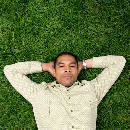 simsearch:600-00983698,k - Man Lying on Grass Stock Photo - Premium Royalty-Free, Code: 600-01014906