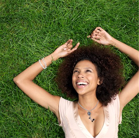 simsearch:600-01195184,k - Woman Lying on Grass Foto de stock - Sin royalties Premium, Código: 600-01014916