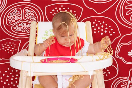 simsearch:600-02348917,k - Baby with Spaghetti in High Chair Stock Photo - Premium Royalty-Free, Code: 600-01015393