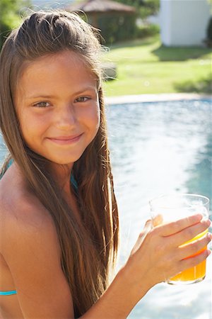 Girl Drinking Orange Juice Stock Photo - Premium Royalty-Free, Code: 600-01036628