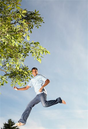 simsearch:600-01036890,k - Man Jumping Foto de stock - Royalty Free Premium, Número: 600-01036888