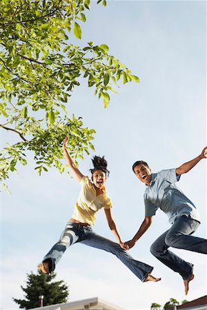 Couple Jumping Stock Photo - Premium Royalty-Free, Code: 600-01036881