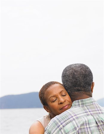 simsearch:600-01606144,k - Couple Hugging by Water Stock Photo - Premium Royalty-Free, Code: 600-01036962