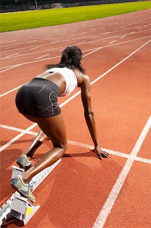 Woman on Starting Blocks Foto de stock - Sin royalties Premium, Código: 600-01037055