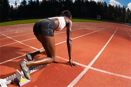 Woman on Starting Blocks Foto de stock - Sin royalties Premium, Código: 600-01037057