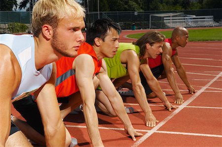 simsearch:700-02033918,k - Men Lined up at Starting Blocks Stock Photo - Premium Royalty-Free, Code: 600-01037065