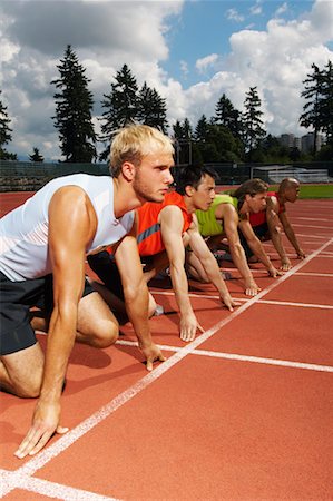 simsearch:700-02033918,k - Men Lined up at Starting Blocks Stock Photo - Premium Royalty-Free, Code: 600-01037066