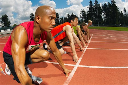 simsearch:600-01195431,k - Men Lined up at Starting Blocks Stock Photo - Premium Royalty-Free, Code: 600-01037068