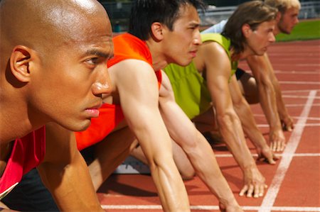 Men Lined up at Starting Blocks Stock Photo - Premium Royalty-Free, Code: 600-01037071