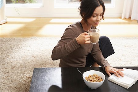 simsearch:700-00592522,k - Woman Reading During Breakfast Stock Photo - Premium Royalty-Free, Code: 600-01041205