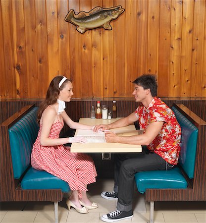 fish restaurant - Couple Sitting in Diner Stock Photo - Premium Royalty-Free, Code: 600-01041429