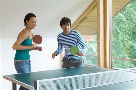 paddle (sports implement) - Couple Playing Ping Pong Stock Photo - Premium Royalty-Free, Code: 600-01041572