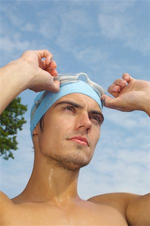 Man Wearing Bathing Cap and Swim Goggles Stock Photo - Premium Royalty-Free, Code: 600-01041670