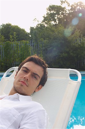 deckchair garden - Man Lounging Poolside Stock Photo - Premium Royalty-Free, Code: 600-01041698