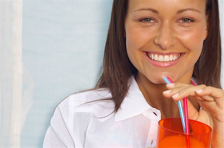 Woman Drinking Beverage Stock Photo - Premium Royalty-Free, Code: 600-01041691