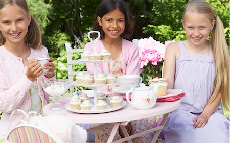 pink cupcake flowers - Girls at Tea Party Stock Photo - Premium Royalty-Free, Code: 600-01041945