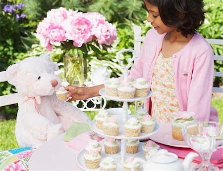 people sitting alone girl with teddy bear - Girl at Tea Party Stock Photo - Premium Royalty-Free, Code: 600-01041942