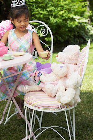 simsearch:600-01041942,k - Girl Serving Tea at Tea Party Stock Photo - Premium Royalty-Free, Code: 600-01041960