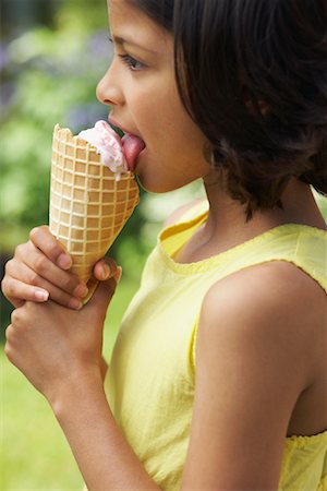 simsearch:600-01072604,k - Girl Eating Ice Cream Cone Fotografie stock - Premium Royalty-Free, Codice: 600-01041979