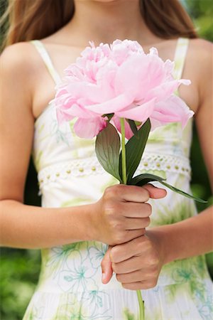 Close-up of Girl Holding Flower Stock Photo - Premium Royalty-Free, Code: 600-01041989