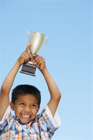 Portrait of Boy Holding Trophy Stock Photo - Premium Royalty-Free, Code: 600-01042028