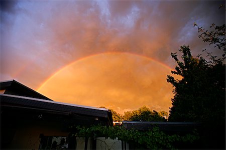 stormy weather rainbow - Rainbow Over House Stock Photo - Premium Royalty-Free, Code: 600-01043047