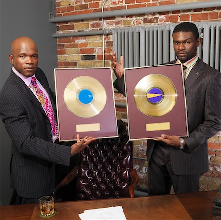 people holding vinyl records - Record Executives Holding Gold Records Stock Photo - Premium Royalty-Free, Code: 600-01043291