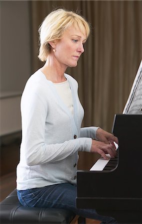 piano practice - Woman Playing Piano Stock Photo - Premium Royalty-Free, Code: 600-01072279