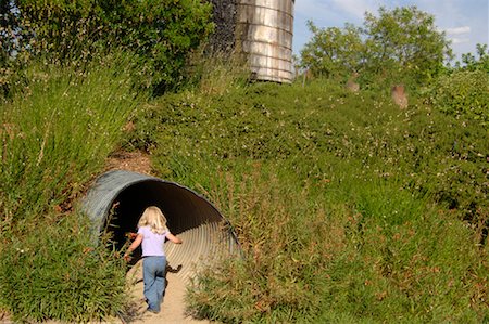 simsearch:600-01571884,k - Girl Exploring Tunnel, The Solar Living Institute, Hopland, California, USA Stock Photo - Premium Royalty-Free, Code: 600-01072456