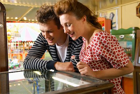 penny arcade - Couple at Carters Steam Fair, England Stock Photo - Premium Royalty-Free, Code: 600-01072623