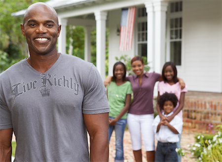 sister back to back - Portrait of Father with Family in Background Stock Photo - Premium Royalty-Free, Code: 600-01072843