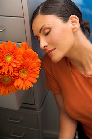 stop to smell the flowers - Woman Smelling Flowers Stock Photo - Premium Royalty-Free, Code: 600-01072996