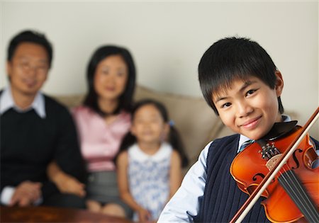 simsearch:700-01633005,k - Portrait of Boy Playing Violin While Family Watches Stock Photo - Premium Royalty-Free, Code: 600-01073079