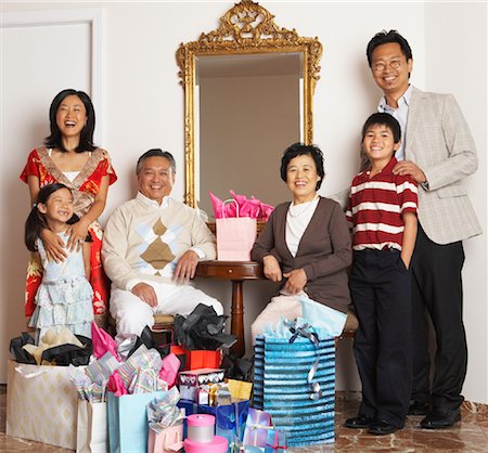 Portrait of Family with Shopping Bags Stock Photo - Premium Royalty-Free, Code: 600-01073127