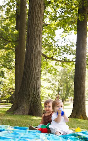 small babies in park - Babies Sitting on Blanket in Park Stock Photo - Premium Royalty-Free, Code: 600-01073142