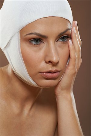 facelift bandage - Portrait of Woman with Bandages On Head Stock Photo - Premium Royalty-Free, Code: 600-01073359