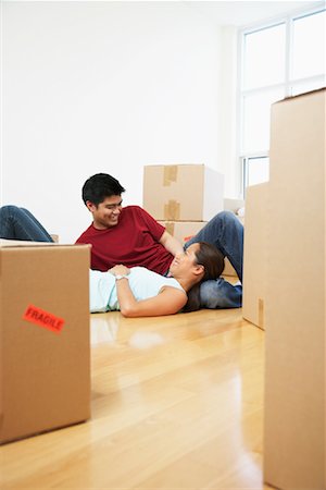 Couple Relaxing in Condo Stock Photo - Premium Royalty-Free, Code: 600-01073473