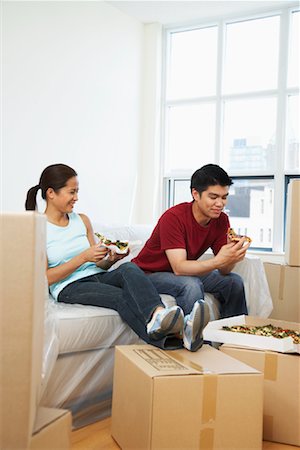 simsearch:700-00077839,k - Couple Eating Pizza in New Condo Stock Photo - Premium Royalty-Free, Code: 600-01073484