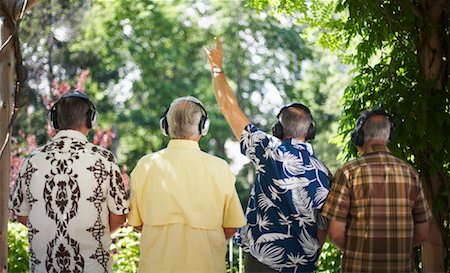 picture of old man in hawaiian shirt - Men Wearing Headphones Listening to Music Stock Photo - Premium Royalty-Free, Code: 600-01073523