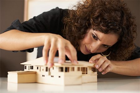 Portrait of Woman Building Model Stock Photo - Premium Royalty-Free, Code: 600-01084259