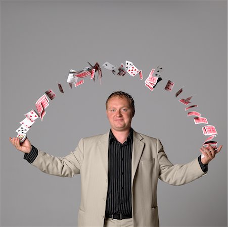 Man Juggling Playing Cards Stock Photo - Premium Royalty-Free, Code: 600-01084278